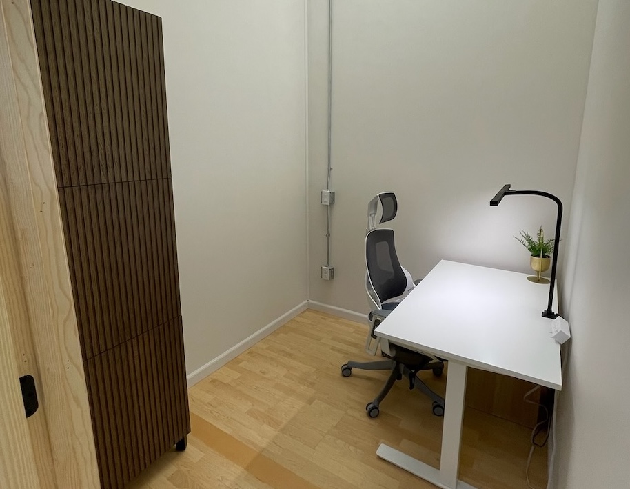 Breckworks new private office space with a couch, and a small library of interesting books to browse.