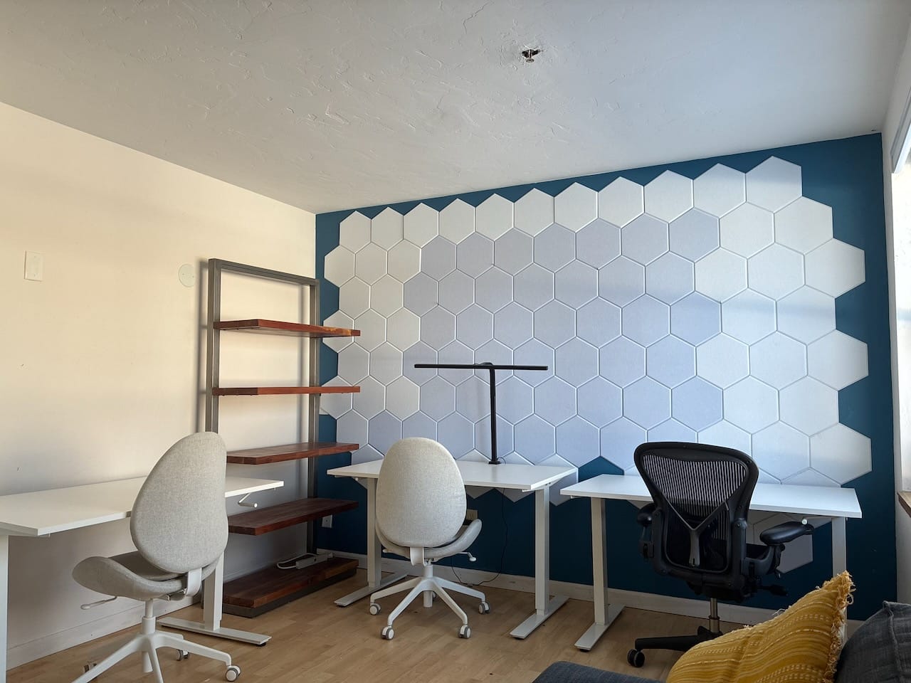 3 Person Office - Available for lease Definitely one of our nicer offerings. The office has enough room for 3-4 people. It's got enough room to dance, and is currently setup with 3 desks, a couch, and a bookshelf. It's enough space to sit comfortably, to have storage, and also a place for a guest to sit down and chat. This office also has a LAN connection so you get really high speed internet if your job requires it.