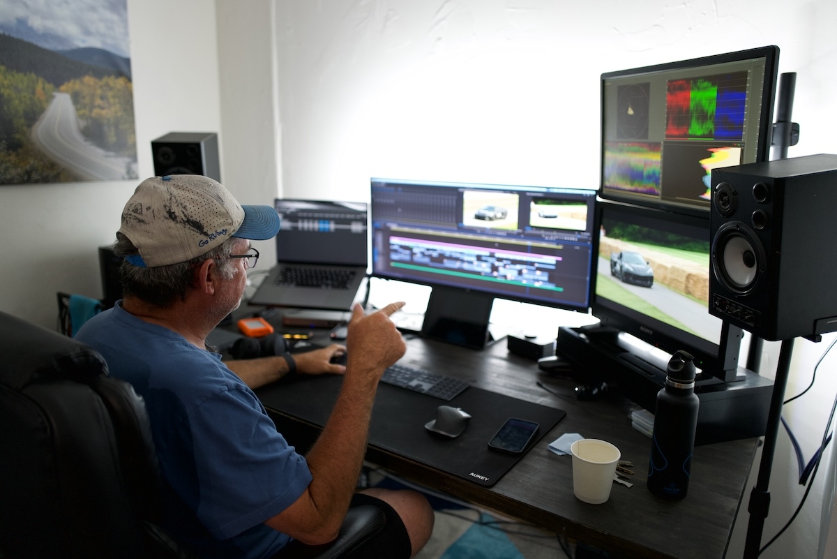 A Video Editor and Colorist working at his office in Breckworks